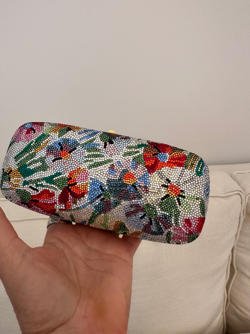 A luxury bag by Judith Leiber embellished all different color crystals